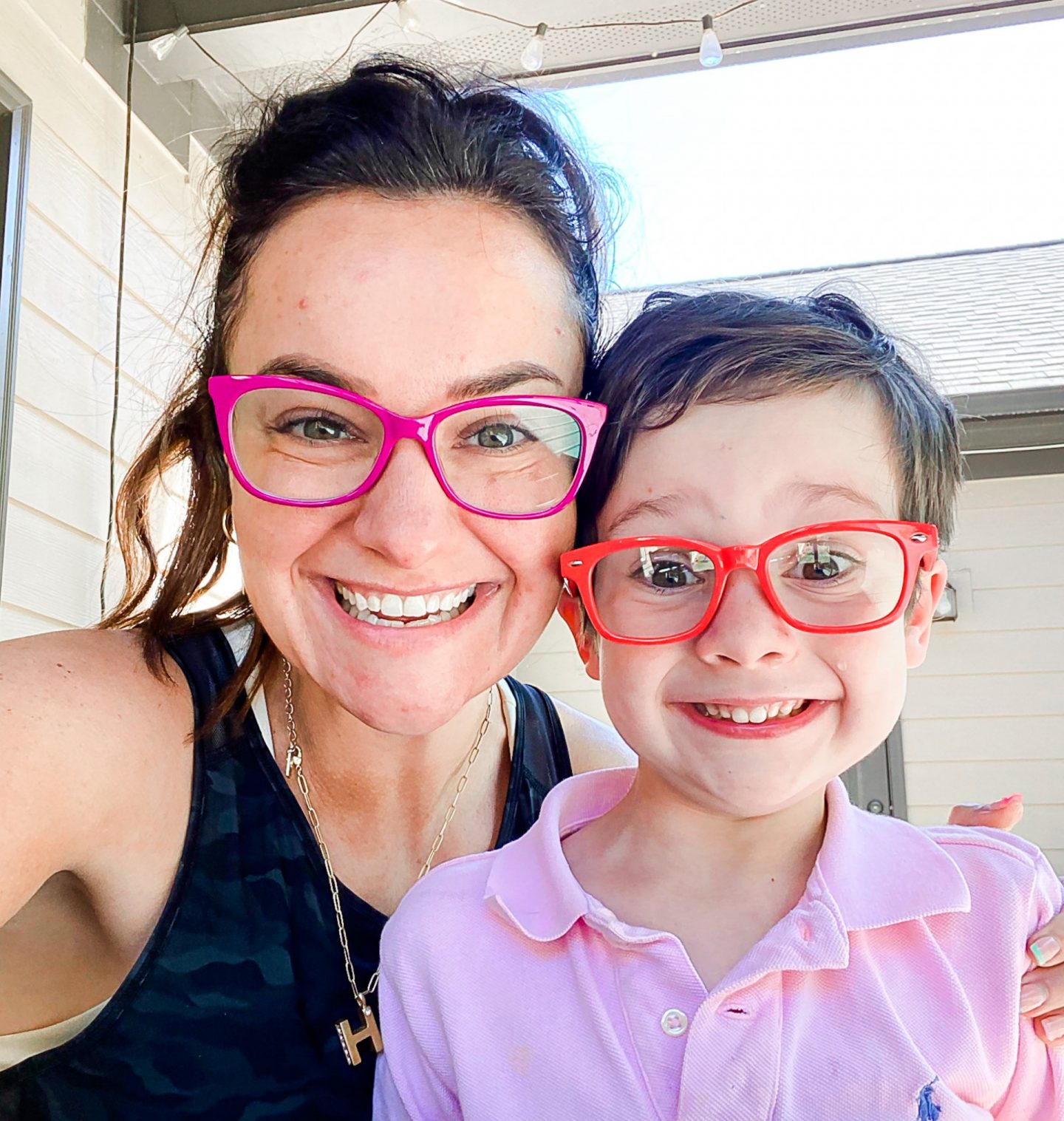 Mom and son matching blue light glasses 