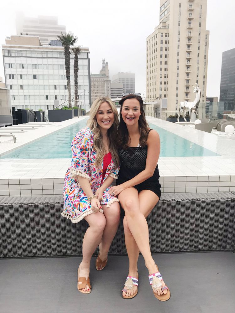 A Complete Dallas Travel Guide featured by top US travel blog, My Life Well Loved: image of women at The Statler Hotel outdoor pool - where to stay in Dallas