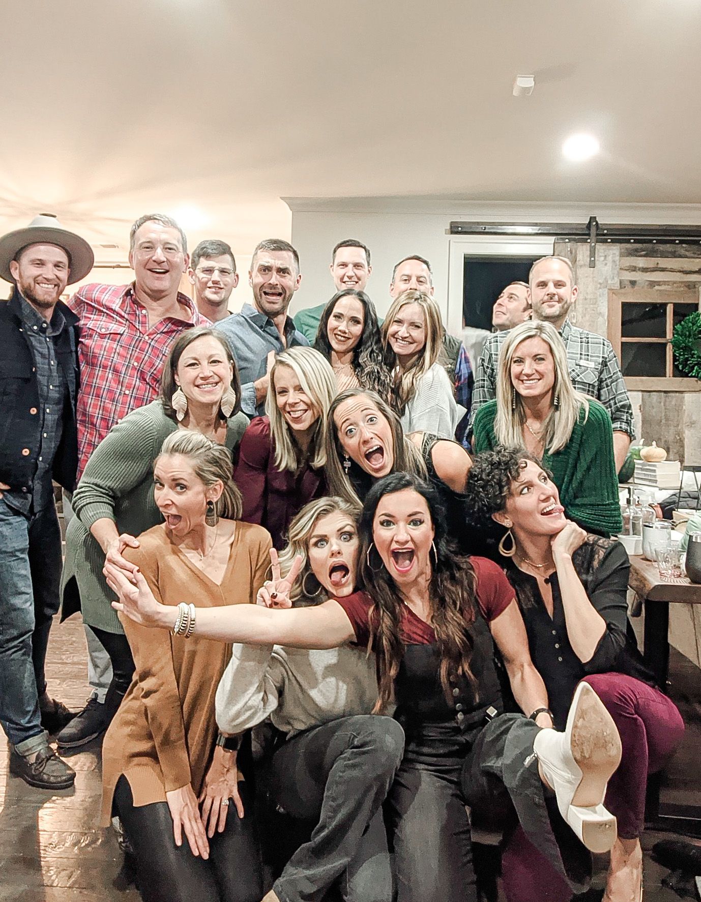 Heather and a group of friends pose for a party photo